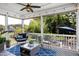 Relaxing screened-in patio with stylish furniture and views of the lush backyard at 205 Silent Cove Ln, Holly Springs, NC 27540