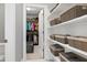 Organized walk-in closet features custom shelving and ample storage space for clothing and accessories at 205 Silent Cove Ln, Holly Springs, NC 27540