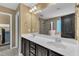 Bathroom with a double sink vanity, large mirror, and walk-in shower in neutral colors at 211 Westgrove Ct, Durham, NC 27703
