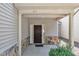 Charming front porch with stone accents and a stylish front door at 211 Westgrove Ct, Durham, NC 27703