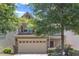 Charming two-story home featuring a stone accent facade, attached garage, and landscaped yard at 211 Westgrove Ct, Durham, NC 27703