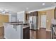 A kitchen view features dark cabinets and stainless steel appliances at 211 Westgrove Ct, Durham, NC 27703