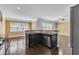 A kitchen view showcases dark wood floors and stainless steel appliances at 211 Westgrove Ct, Durham, NC 27703