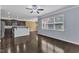 Bright living room with hardwood floors offering an eat-in kitchen and large window at 211 Westgrove Ct, Durham, NC 27703