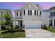 Charming two-story home with a two-car garage and manicured landscaping at 2128 Jollay St, Durham, NC 27703