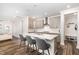 Modern kitchen with stainless steel appliances, island seating and plenty of cabinet space at 2128 Jollay St, Durham, NC 27703
