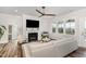 Comfortable living room with a fireplace, ceiling fan and natural light at 2128 Jollay St, Durham, NC 27703