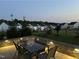 Cozy outdoor patio with stone floor, table, chairs and lighting at 2128 Jollay St, Durham, NC 27703