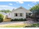 Backyard features the home's exterior, greenery, partial privacy fence, and patio space at 2225 Creston Rd, Raleigh, NC 27608