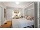 Bedroom featuring a Murphy bed, desk, and decor, offering flexible space-saving options at 2225 Creston Rd, Raleigh, NC 27608