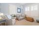 Neutral Bedroom with charming chair, woven basket and blue accents at 2225 Creston Rd, Raleigh, NC 27608