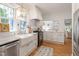 Bright kitchen features modern appliances, marble countertops, farmhouse sink, and hardwood floors at 2225 Creston Rd, Raleigh, NC 27608