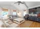 Bright living room with vaulted ceiling, ceiling fan, neutral walls, comfortable seating, and natural light at 2225 Creston Rd, Raleigh, NC 27608