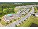 A vibrant community aerial view highlighting the clubhouse, pool, and well-maintained streetscape with manicured lawns at 2264 Jollay St, Durham, NC 27703