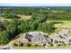 Stunning aerial view showcasing the community clubhouse and sparkling pool surrounded by lush greenery at 2264 Jollay St, Durham, NC 27703