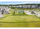 A beautiful community aerial view of the green spaces featuring tennis courts, soccer fields, and playground equipment at 2264 Jollay St, Durham, NC 27703