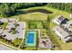 Overhead shot showcases the community's recreational facilities: tennis courts, playground, dog park, and pond at 2264 Jollay St, Durham, NC 27703