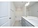 Bright bathroom featuring double sink vanity with modern fixtures, bathtub, and shower at 2264 Jollay St, Durham, NC 27703