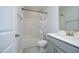 Small bathroom featuring a shower with floral curtains, a toilet, and a sink at 2264 Jollay St, Durham, NC 27703