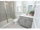 Bathroom featuring a glass-enclosed shower, modern vanity, and neutral color palette at 2264 Jollay St, Durham, NC 27703