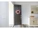 Bright entryway featuring a welcoming front door and stylish decor accents at 2264 Jollay St, Durham, NC 27703