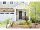 Inviting front porch with stone accents and a landscaped garden, perfect for relaxing outdoors at 2264 Jollay St, Durham, NC 27703