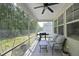 Relaxing screened porch with comfortable seating, ceiling fan, and a view of the backyard at 2264 Jollay St, Durham, NC 27703