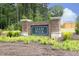 Attractive brick sign for Ellis Walk community, set amongst flowers and landscaping at 2264 Jollay St, Durham, NC 27703