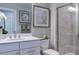 Bright bathroom with a clean vanity, modern sink, and walk-in shower with decorative tile at 237 Tidal Pool Way, Cary, NC 27519