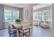 Inviting dining room filled with natural light with an adjacent living space, showcasing an open design at 237 Tidal Pool Way, Cary, NC 27519