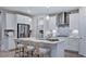 Kitchen boasting an island with seating, stainless steel appliances, and ample storage at 237 Tidal Pool Way, Cary, NC 27519