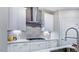 Close-up showcasing modern kitchen details with stainless steel appliances and white cabinetry at 237 Tidal Pool Way, Cary, NC 27519