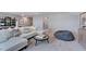 Spacious living room featuring a comfortable couch and a relaxed, inviting atmosphere at 237 Tidal Pool Way, Cary, NC 27519