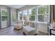 Relaxing sitting area with large windows offering views of the lush outdoors at 237 Tidal Pool Way, Cary, NC 27519