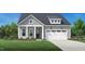 Charming home featuring a 2-car garage, beautiful landscaping, and welcoming front porch at 2400 Abbeyhill Dr # 36, Raleigh, NC 27610