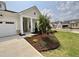 Landscaped front of new home with large driveway at 2400 Abbeyhill Dr # 36, Raleigh, NC 27610