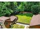 Stunning aerial view of a wood home with a vast, well-kept lawn surrounded by lush greenery at 2416 Kearney Rd, Wake Forest, NC 27587