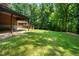 Enjoy your own oasis with luscious lawn, mature trees, and plenty of space to relax at 2416 Kearney Rd, Wake Forest, NC 27587