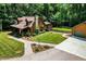 Charming log home exterior with stone chimney and a well-manicured lawn at 2416 Kearney Rd, Wake Forest, NC 27587