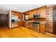 Stylish kitchen featuring stainless steel appliances, granite countertops, and wood cabinets for a rustic feel at 2416 Kearney Rd, Wake Forest, NC 27587