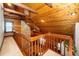 Open loft space with wood-paneled walls and ceilings, showcasing a stone fireplace at 2416 Kearney Rd, Wake Forest, NC 27587