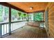 View of the covered porch with a swing and hanging plants, perfect for relaxing at 2416 Kearney Rd, Wake Forest, NC 27587