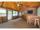 Cozy sunroom with wood ceilings, a ceiling fan, and access to the outdoors at 2416 Kearney Rd, Wake Forest, NC 27587