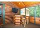 View of sunroom featuring a mini bar with wood stools for entertaining guests at 2416 Kearney Rd, Wake Forest, NC 27587