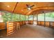 Relax in this sunroom featuring wood ceiling, a ceiling fan, carpet floor, and a bar for entertaining at 2416 Kearney Rd, Wake Forest, NC 27587