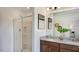 Contemporary bathroom with dual sinks, granite countertops, and a glass-enclosed shower, offering a spa-like experience at 2728 Sammish Way, Raleigh, NC 27616