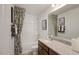 Well-lit bathroom featuring a combination tub and shower, a modern vanity, and stylish accents, offering a relaxing space at 2728 Sammish Way, Raleigh, NC 27616