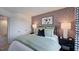Cozy bedroom featuring a soccer themed wallpaper, a comfortable bed, and stylish decor, creating a playful atmosphere at 2728 Sammish Way, Raleigh, NC 27616
