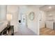 Hallway featuring neutral walls, carpet, and access to rooms including a laundry room with a washer and dryer at 2728 Sammish Way, Raleigh, NC 27616