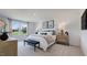 Bright main bedroom suite featuring a large window with scenic views, providing a relaxing and luxurious retreat at 2728 Sammish Way, Raleigh, NC 27616